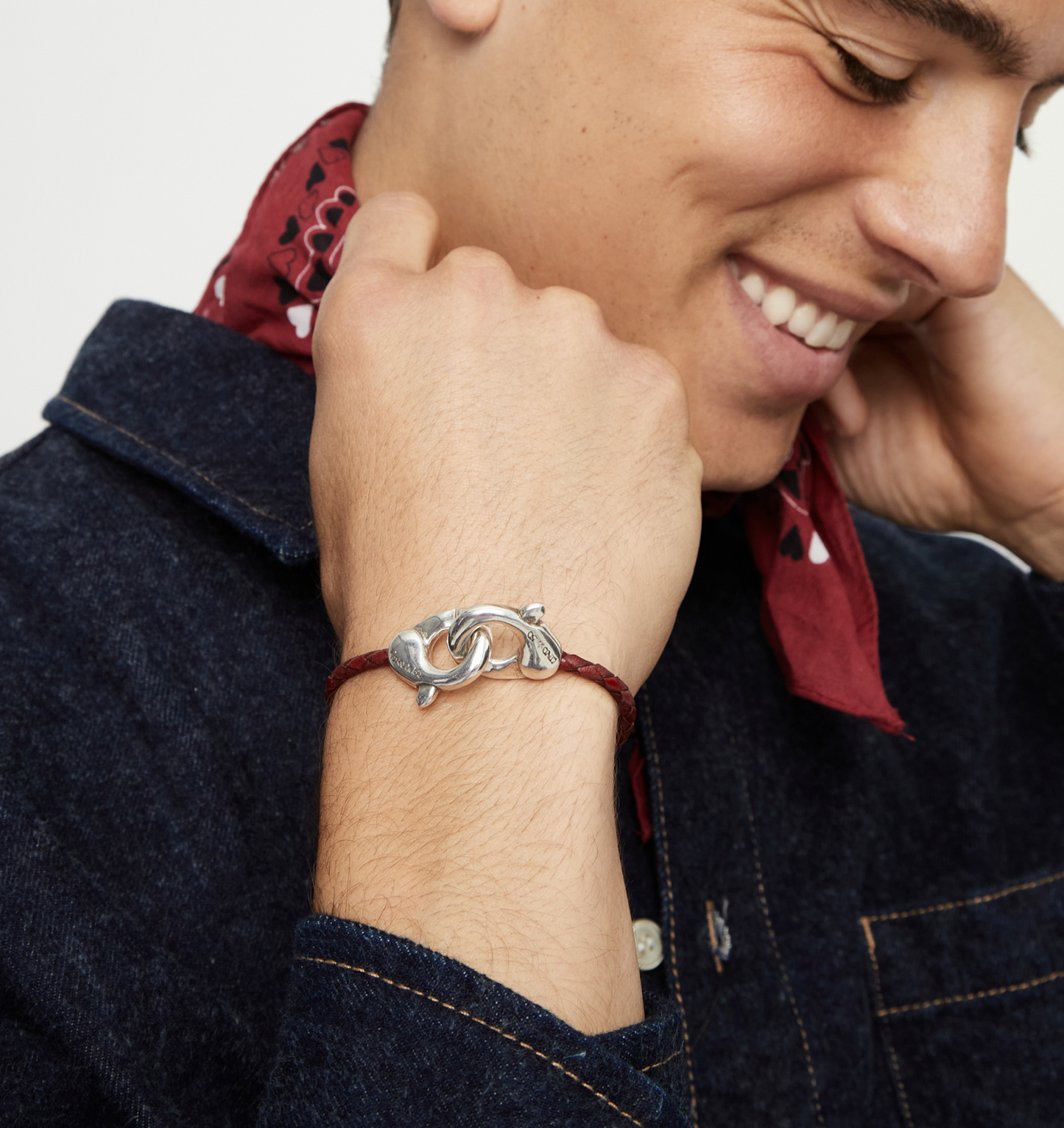 Red leather bracelet with interlocking carabiner