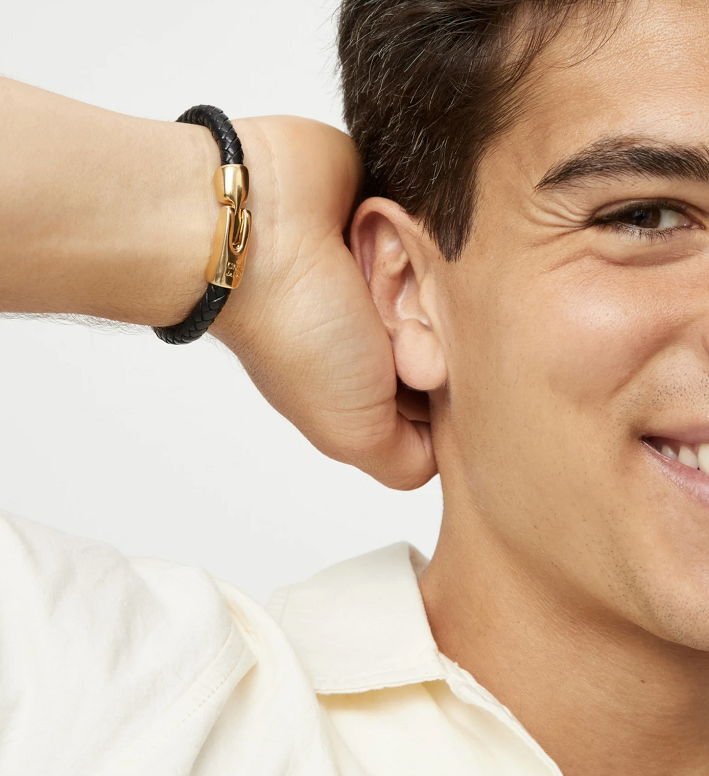 Leather braided bracelet with golden clasp
