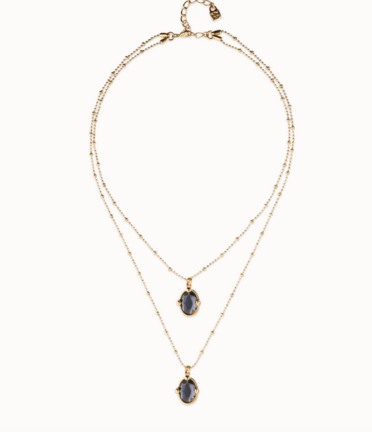 Collar doble bañado en oro 18k con dos cristales facetados ovalados negros