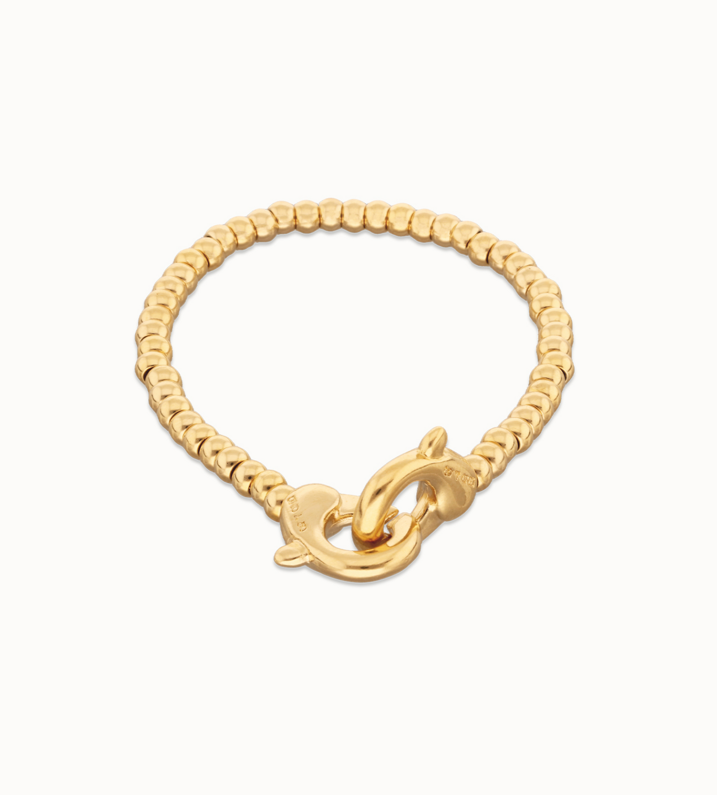 Pulsera de bolas pequeñas bañada en oro con mosquetón entrelazado
