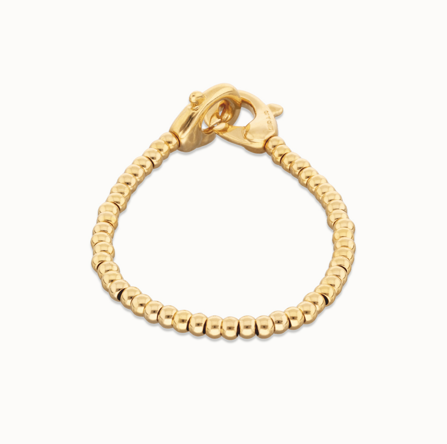 Pulsera de bolas pequeñas bañada en oro con mosquetón entrelazado