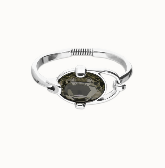Pulsera rígida bañada en plata de ley con cristal facetado ovalado gris