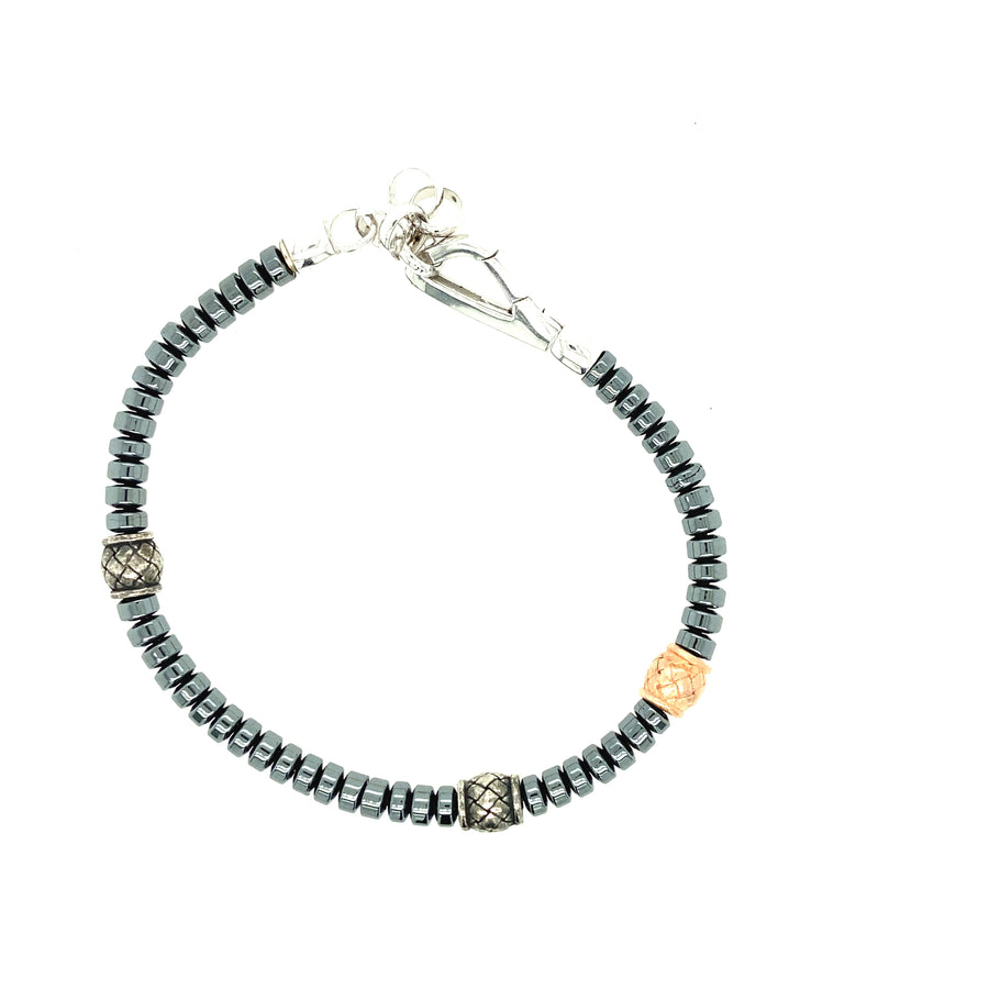 Hermatita gris mate y marrón con elementos de plata y oro rosa