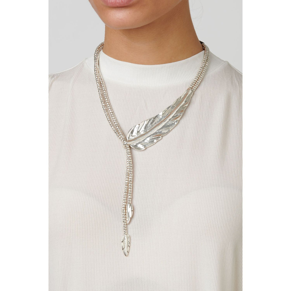 FEATHER | Uno de 50 | Luby 